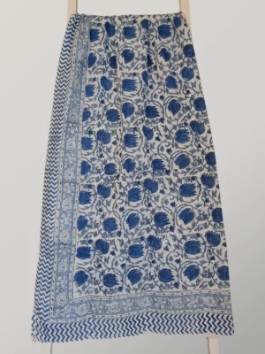 Blue Crush cotton sarong hanging full length, showing its vivid cobalt blue and crisp white floral print