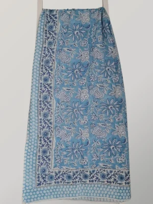 Bluebell cotton sarong hanging full length, showing its powder blue, white and indigo floral print