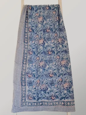 Blueberry Cream cotton sarong hanging full length, showing its washed blue and navy print with touches of blush