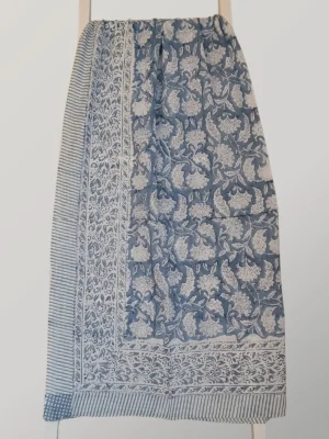 Cloud Nine cotton sarong hanging full length, showing its soft slate blue and creamy ivory print
