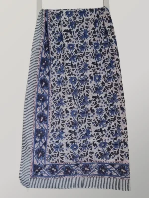 Indigo Ink cotton sarong hanging full length, showing its classic indigo and ivory floral print